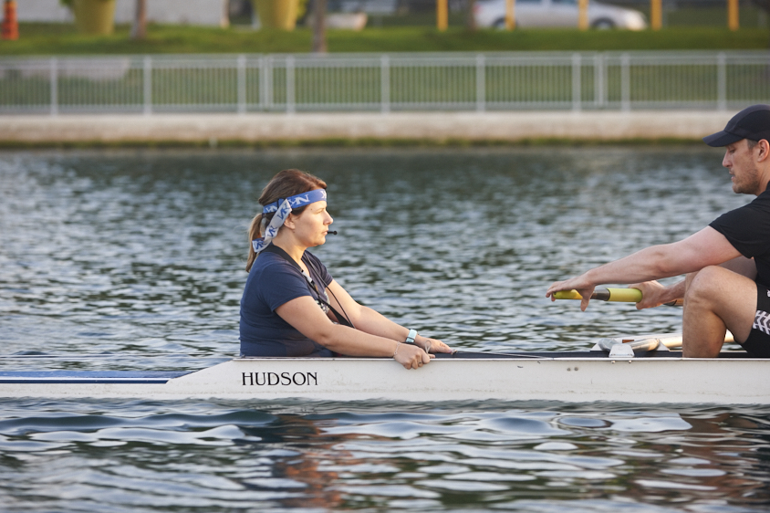 Argonaut Rowing Club woman and coachWoman being coached on rowing